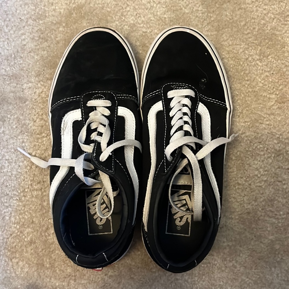 black low top laced vans